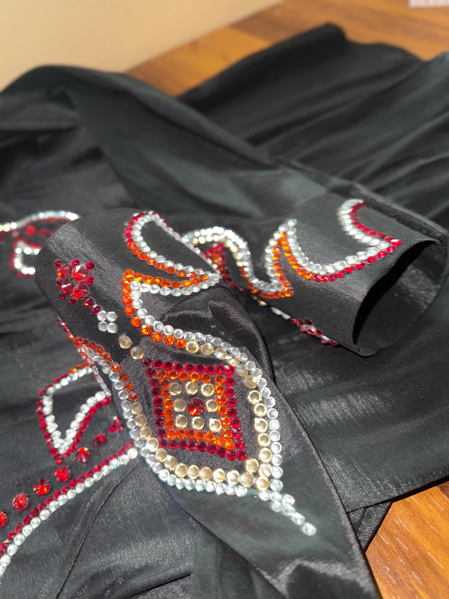 Premium stretchable taffeta shirt  Elegant black with red, orange, and white rhinestone accents