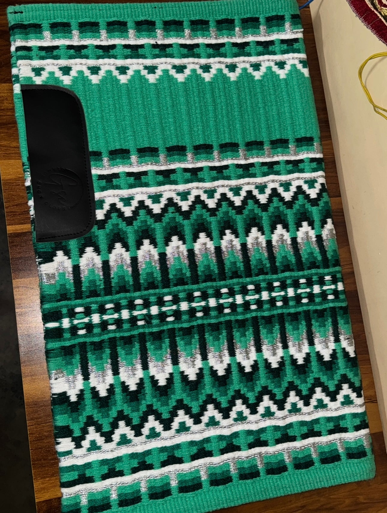 Green colour base showpad with white black and silver